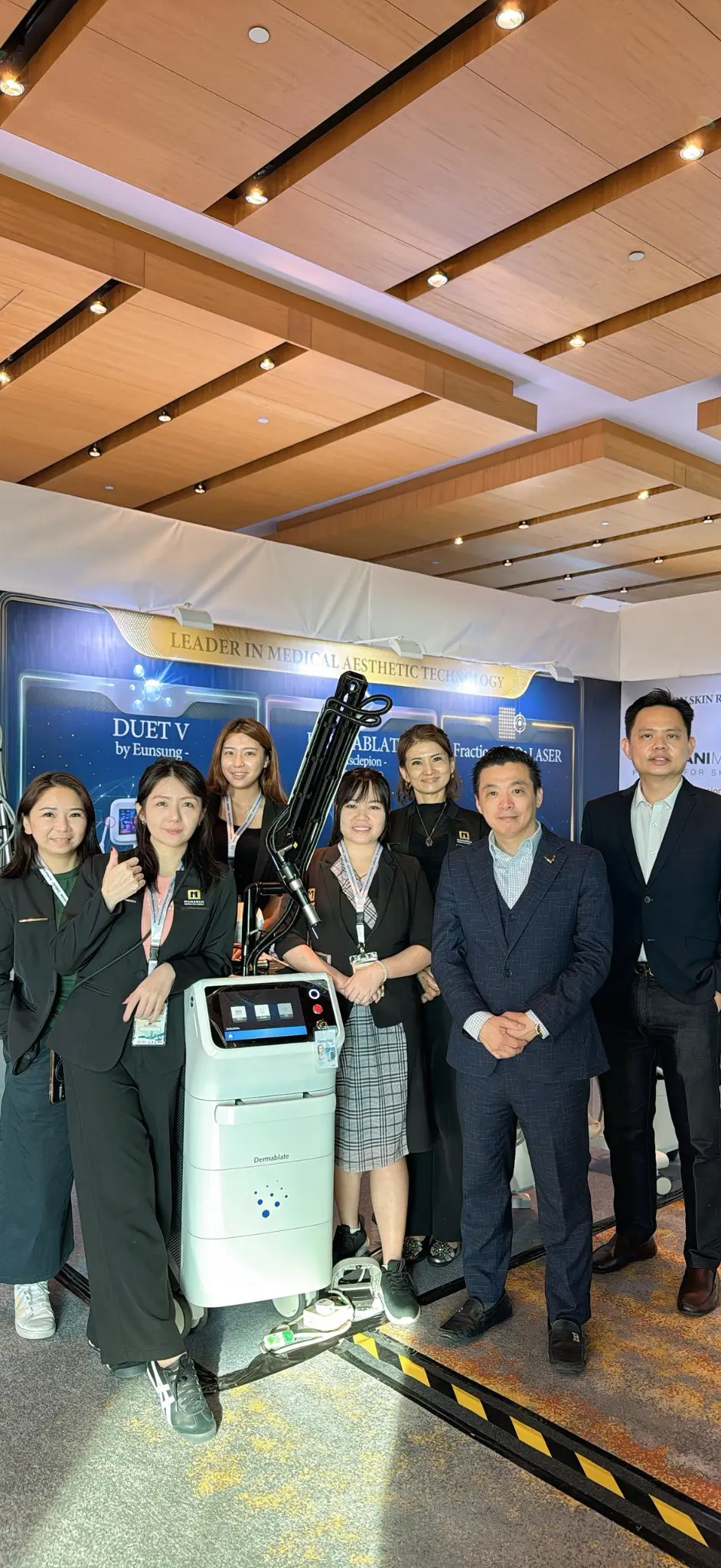 Monarch Medi Solutions team with the Dermablate Er:YAG laser at the Northern Dermatology Summit 2026 booth