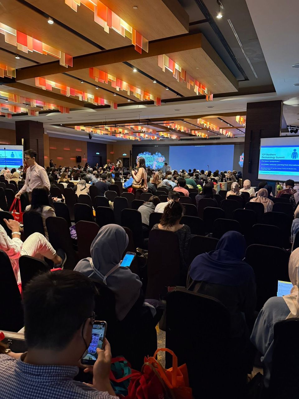 Full conference hall at the 13th Northern Dermatology Summit 2026 with hundreds of dermatology professionals